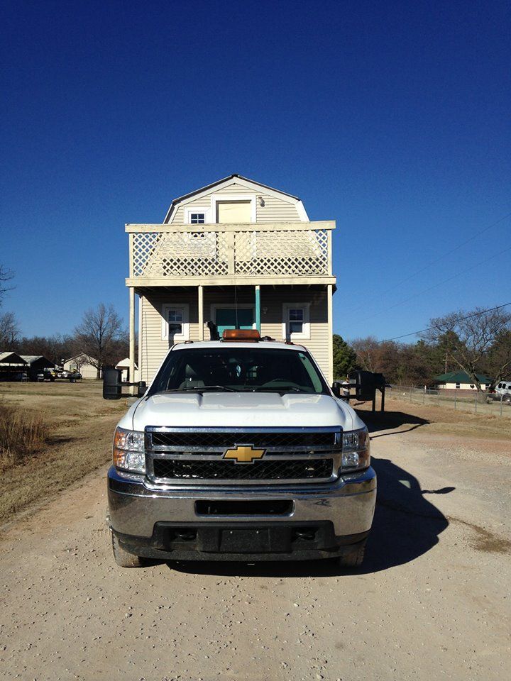 Truck Carrying House Behind — Tecumseh, OK — Jacks Mobile Home Service