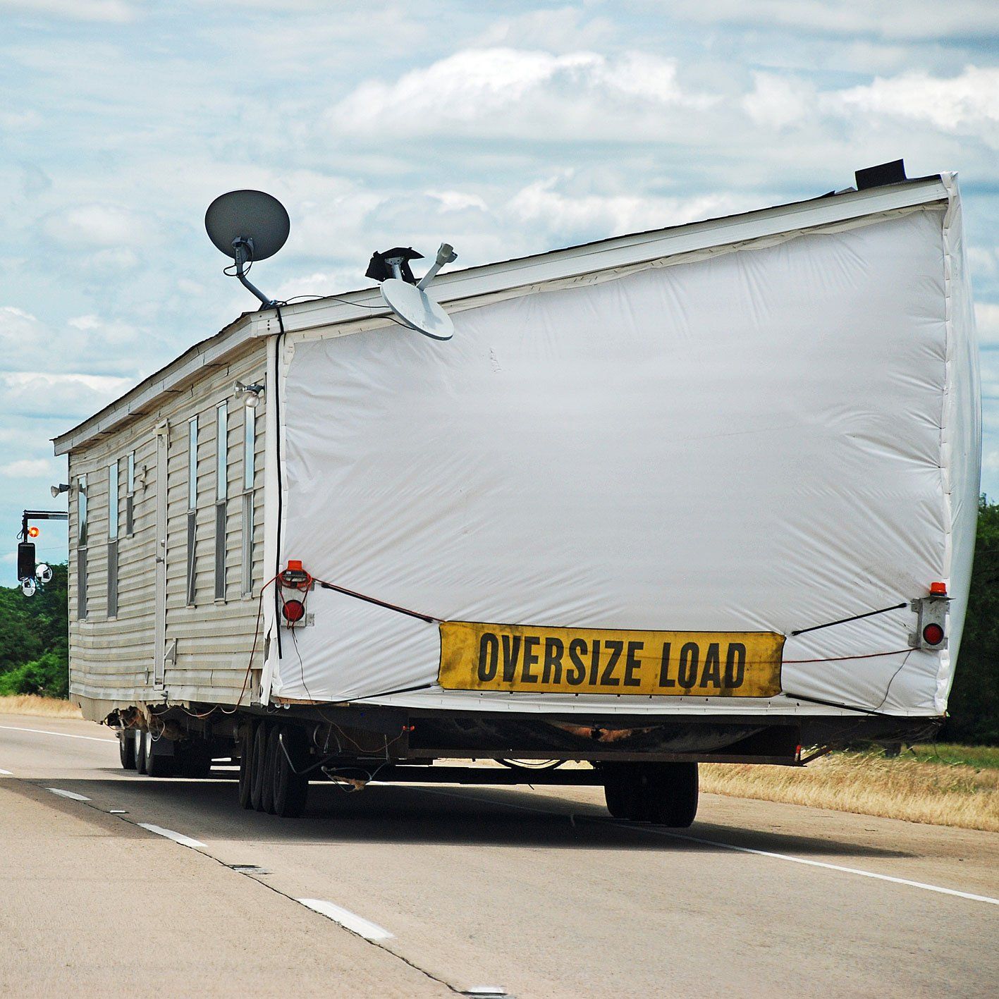 Moving Sheds — House Trailer on A Highway in Tecumseh, OK