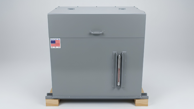 Gray metal storage cabinet on a wooden pallet, with a front door and small American flag sticker.