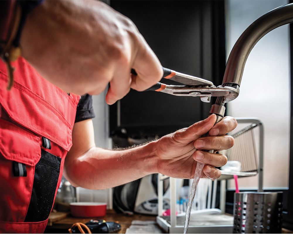 Worker Repairing Faucet – Cleburne, TX – Mr. Bill's Plumbing