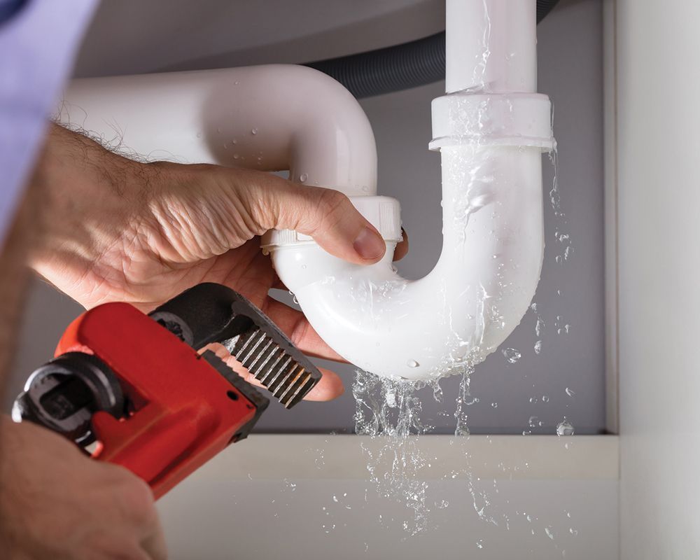 Worker Repairing Drain Pipe – Cleburne, TX – Mr. Bill's Plumbing