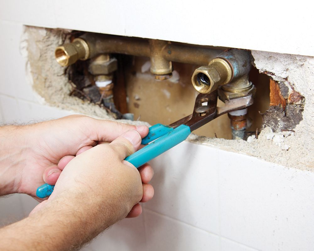 Worker Repairing Shower Lines – Cleburne, TX – Mr. Bill's Plumbing