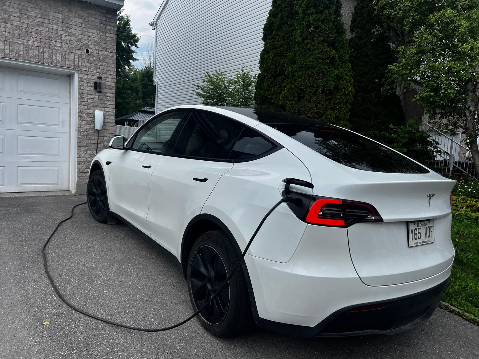 someone using an ev charger for his car