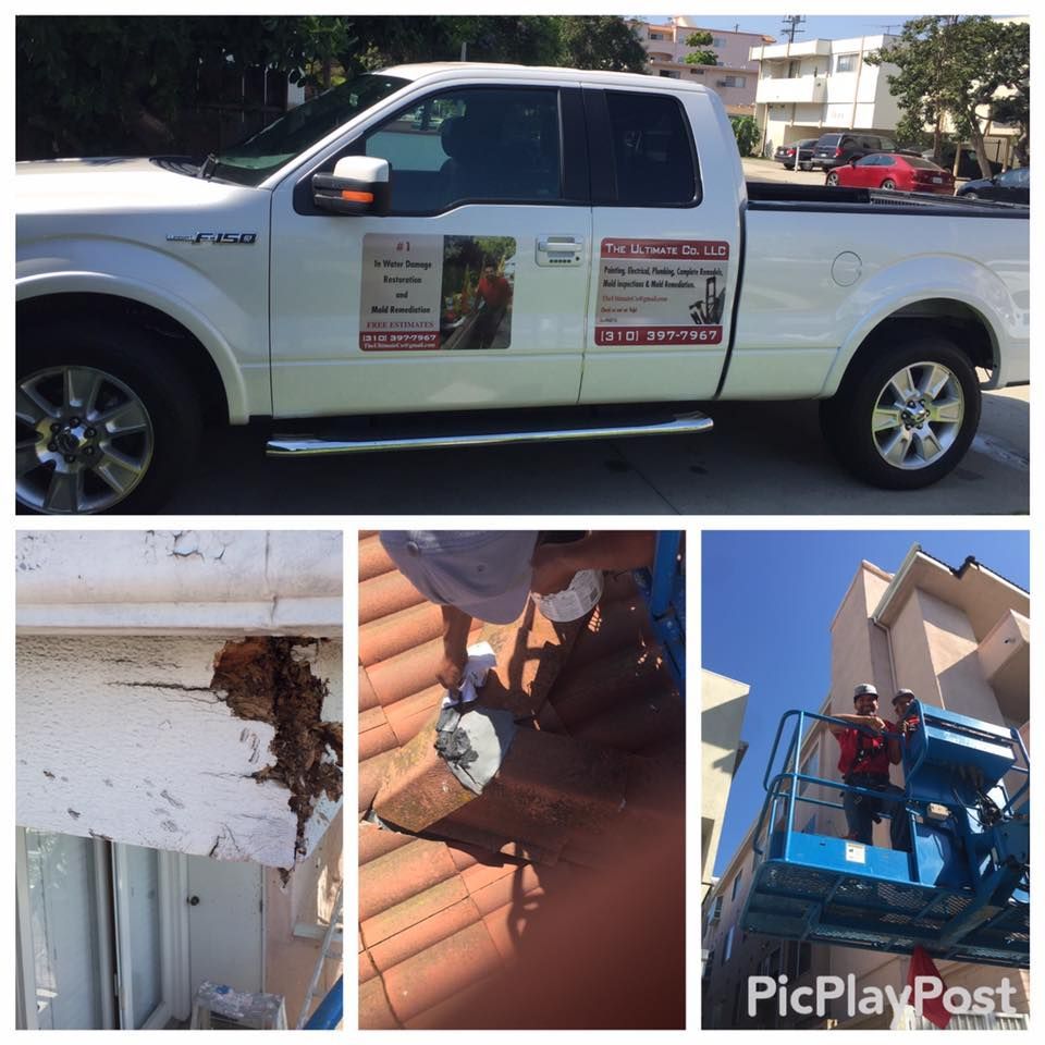 White truck with company logo and people working on a roof and exterior wall.