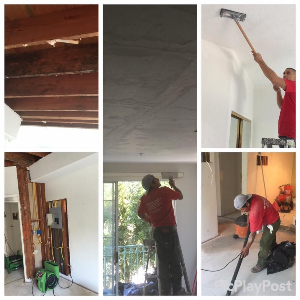 Workers repairing a ceiling; sanding, vacuuming, and applying plaster in a room with exposed beams.