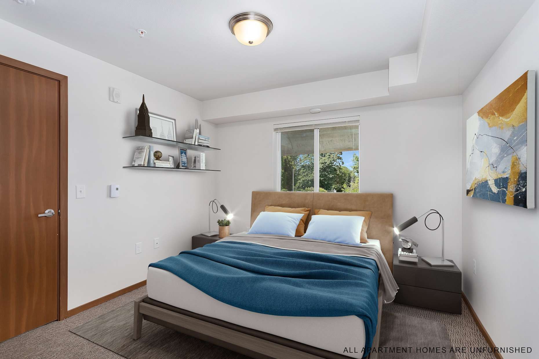 Bedroom with a bed, nightstands, and shelves against white walls; a blue blanket, and art.