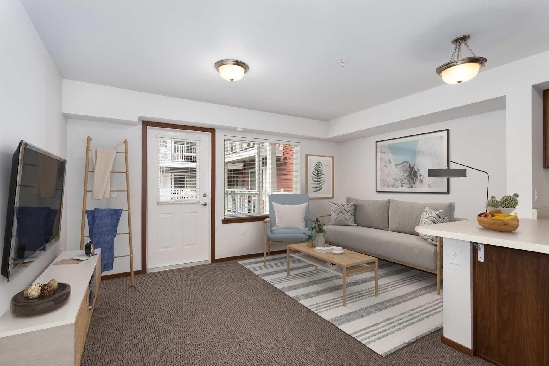 Cozy living room with TV, couch, rug, and door leading outside.