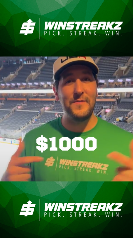 A man in a green shirt is pointing at a sign that says $ 1000