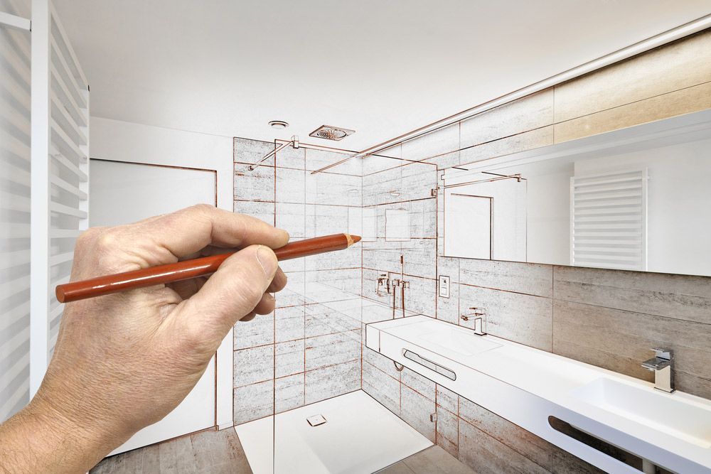 A Person Is Drawing A Bathroom With A Pencil — Morphett Construction In Gunnedah, NSW