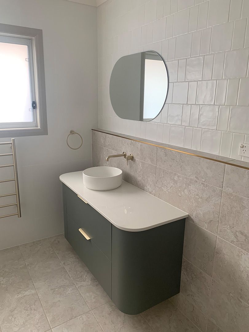A Bathroom With A Sink , Mirror And Window — Morphett Construction In Quirindi, NSW