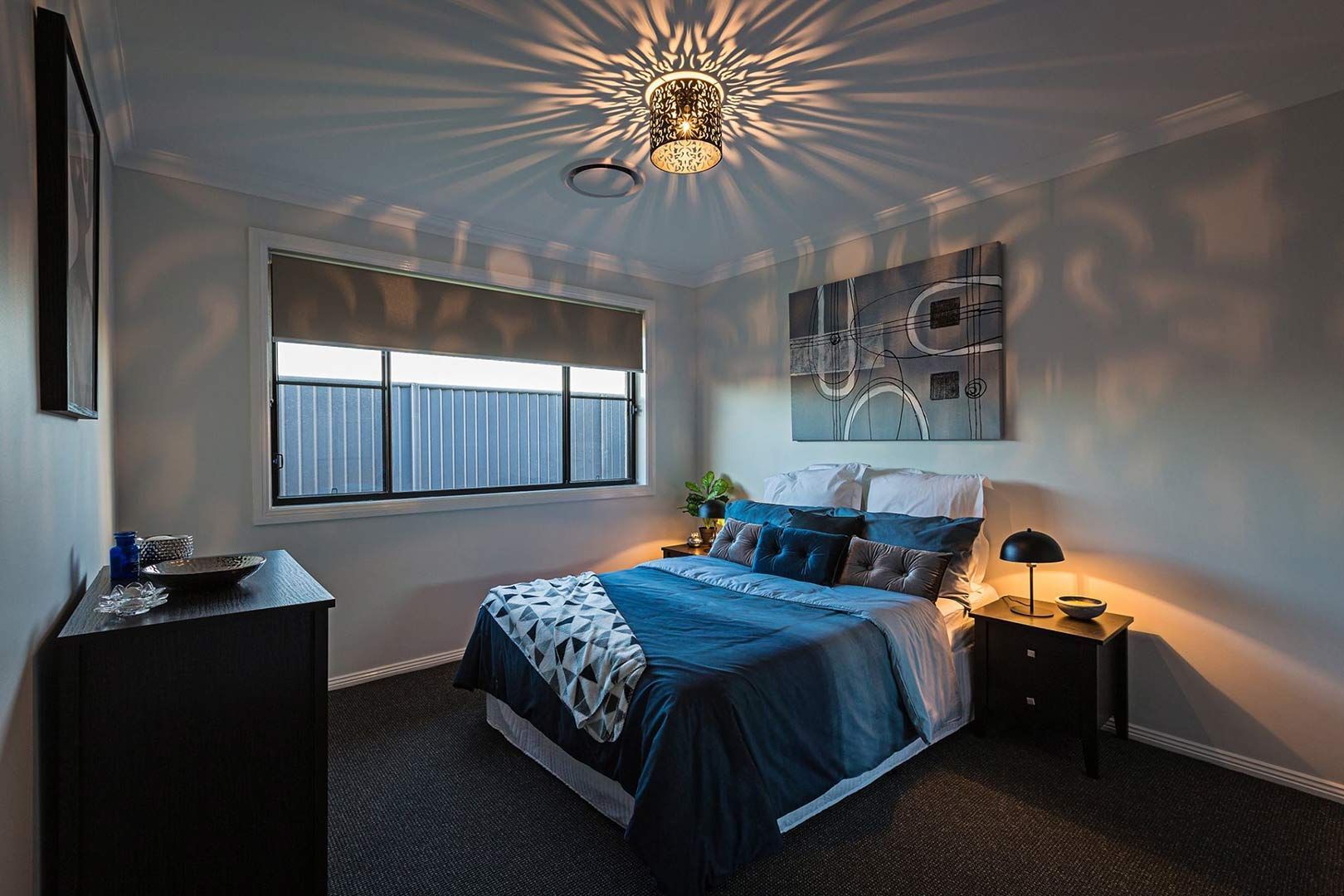 A Bedroom With A Bed , Nightstand , Dresser And Window — Morphett Construction In Calala, NSW