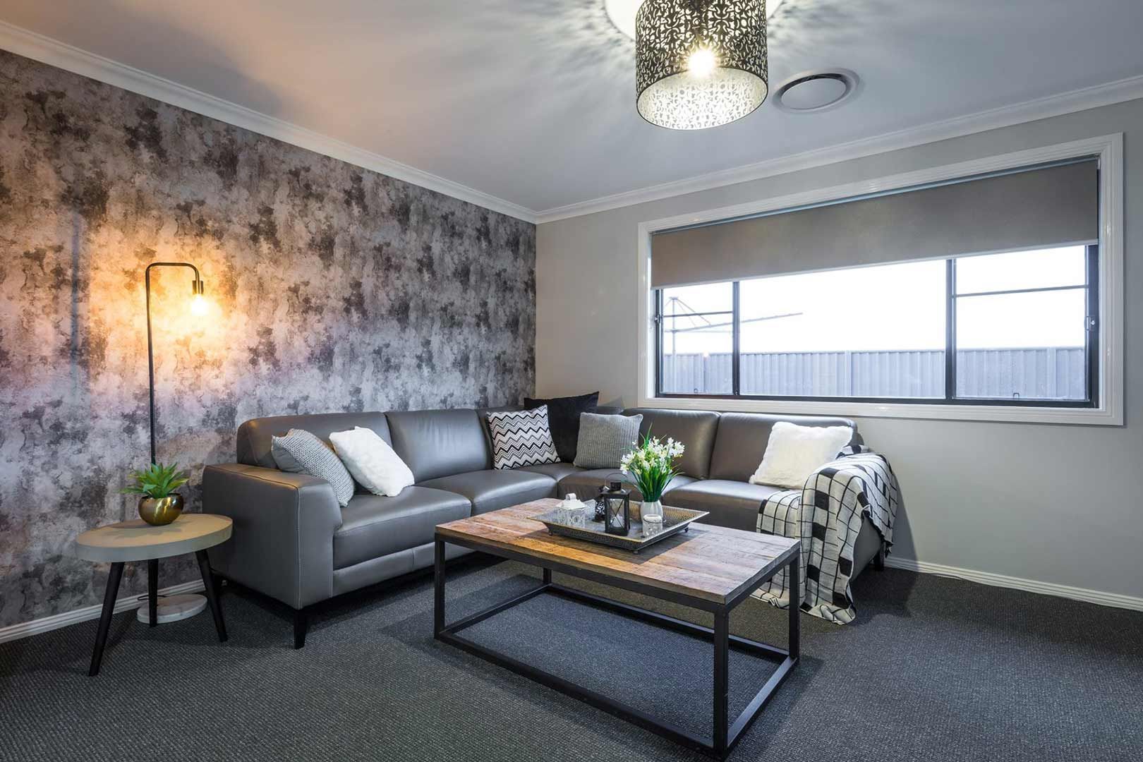 A Living Room With A Couch And A Coffee Table — Morphett Construction In Calala, NSW