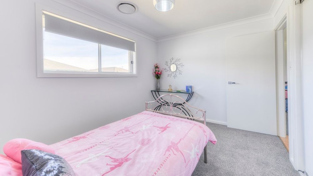 A Bathroom With A Bathtub , Sink And Mirror — Morphett Construction In Gunnedah, NSW
