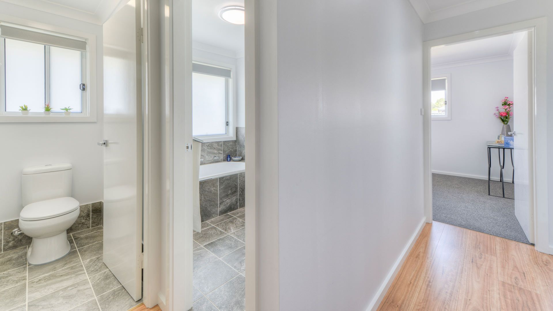 A Hallway Leading To A Bathroom And A Bedroom In A House — Morphett Construction In Calala, NSW