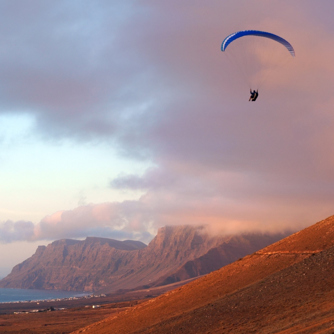 Adapted paragliding near Famara Beach in Lanzarote