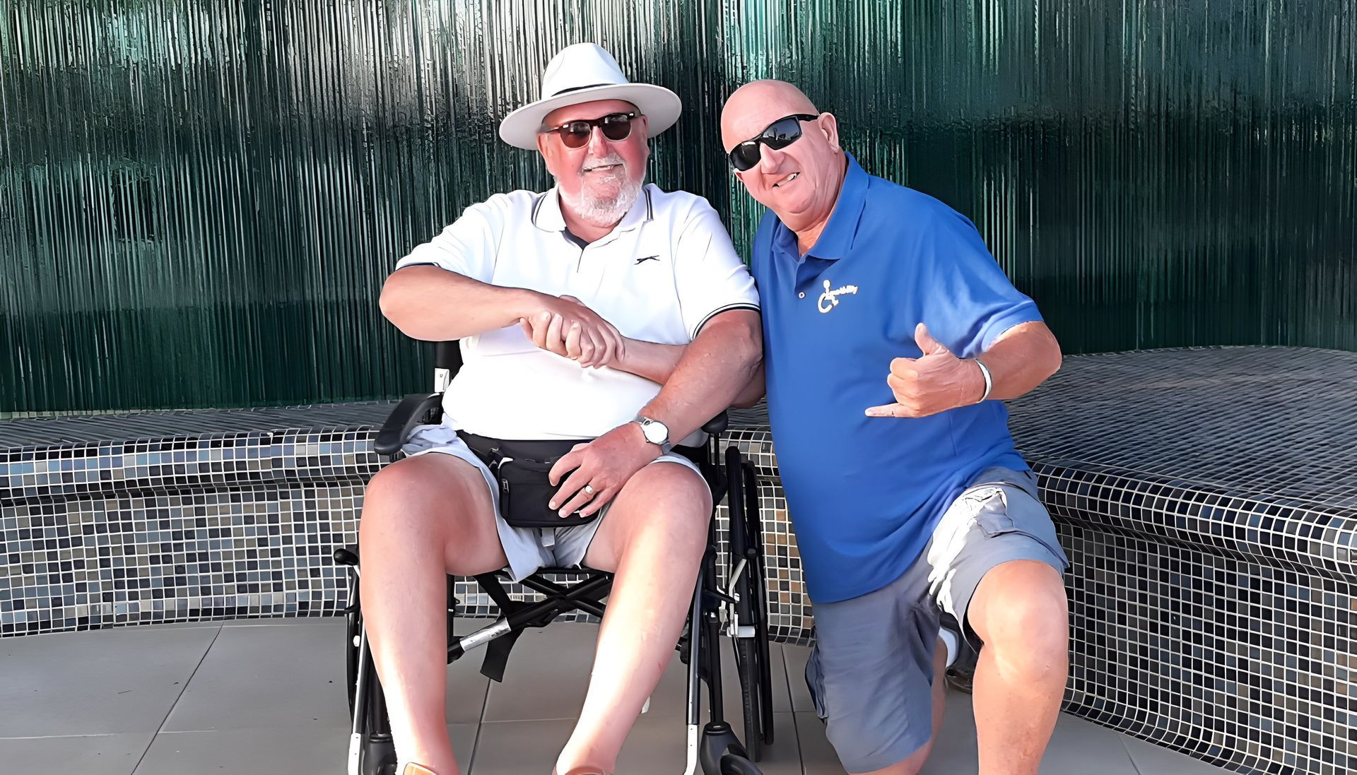Crazy DAVID shaking hands with a holiday guest in a wheelchair.