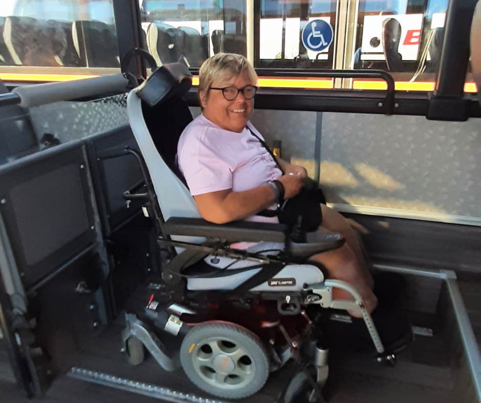 Hayley on her wheelchair, sitting on a bus to travel to Timanfaya national park