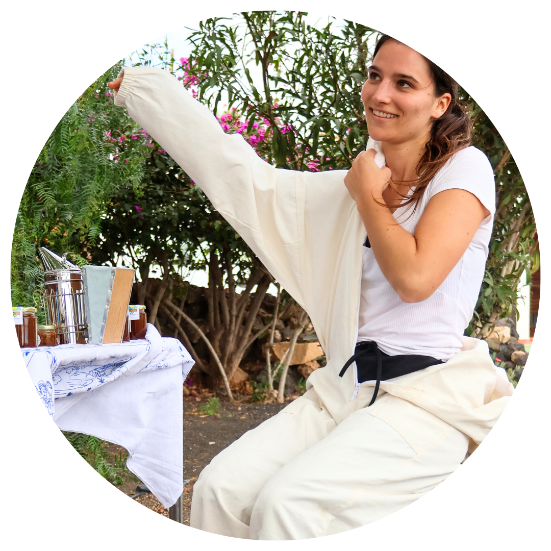 A woman is sitting in front of a table holding a white cloth