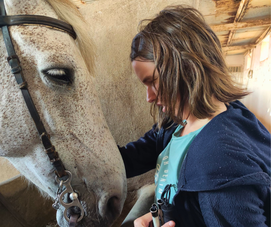 Maša interacting with a horse