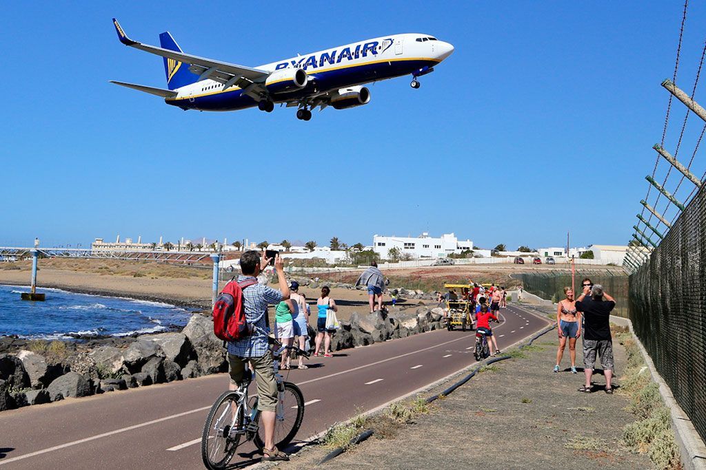 A ryanair plane is taking off from an airport