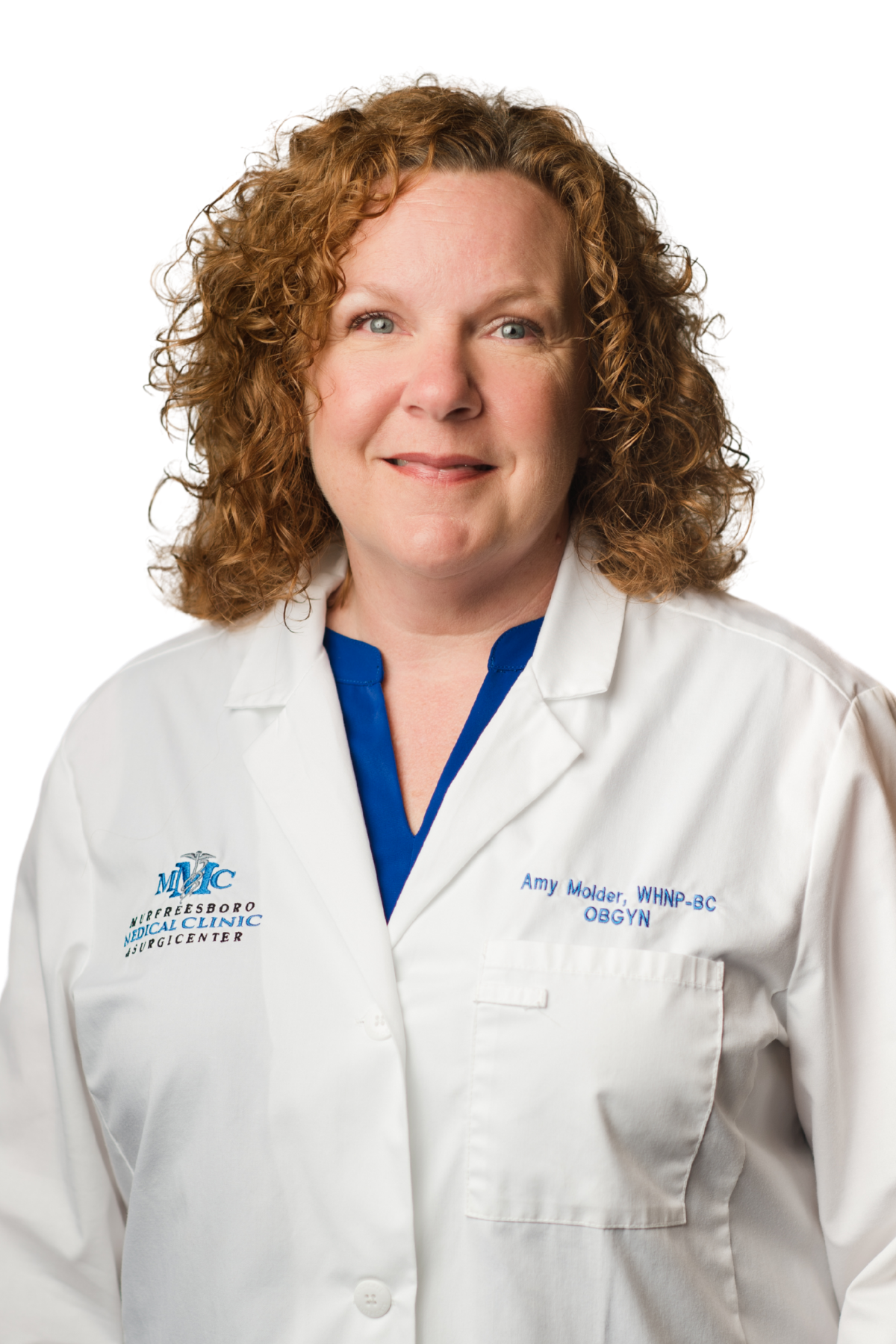 A woman in a white lab coat is smiling for the camera.