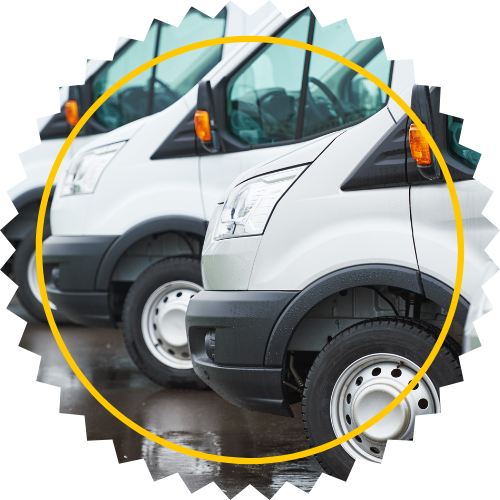 Two white vans are parked next to each other with a yellow circle around them