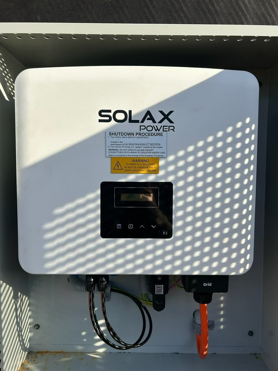 A Solar Power Inverter is Sitting Inside of a Box — DLG Electrical & Solar In Wyong, NSW