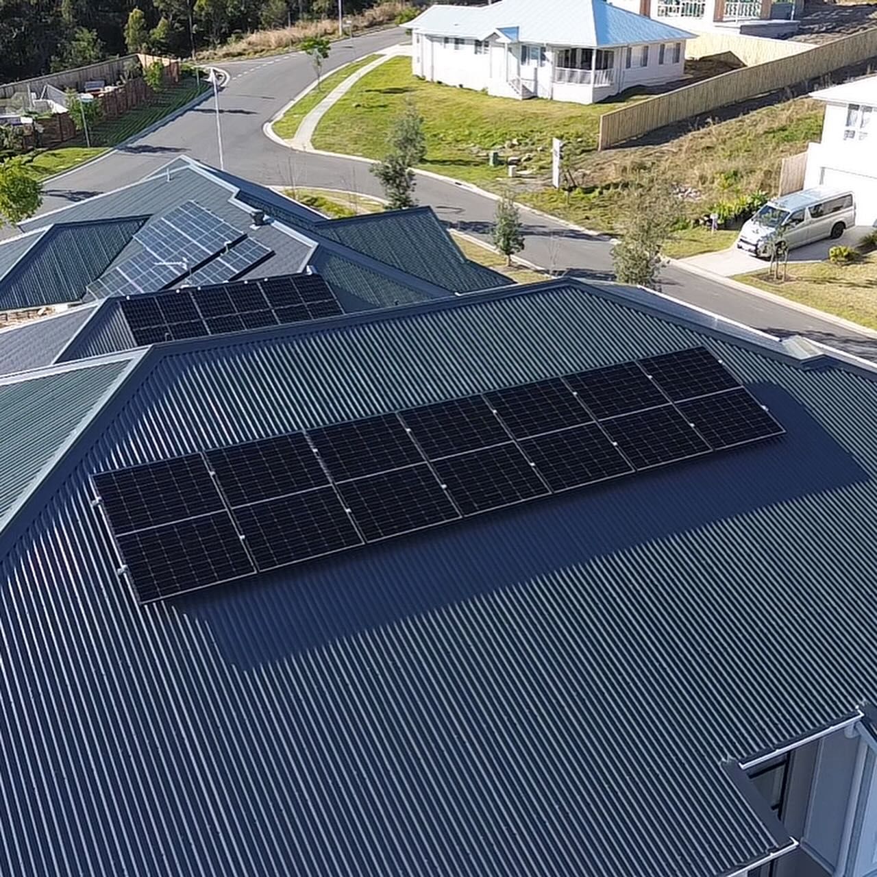 An Aerial View of a House With Solar Panels on the Roof — DLG Electrical & Solar In Wyong, NSW