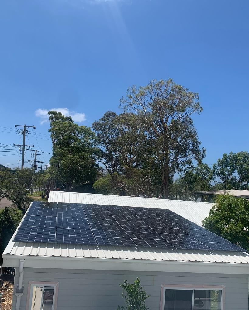 A House With a Lot of Solar Panels on the Roof — DLG Electrical & Solar In Newcastle, NSW