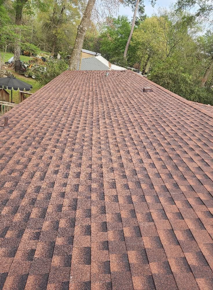 A close up of a roof with a lot of shingles on it.