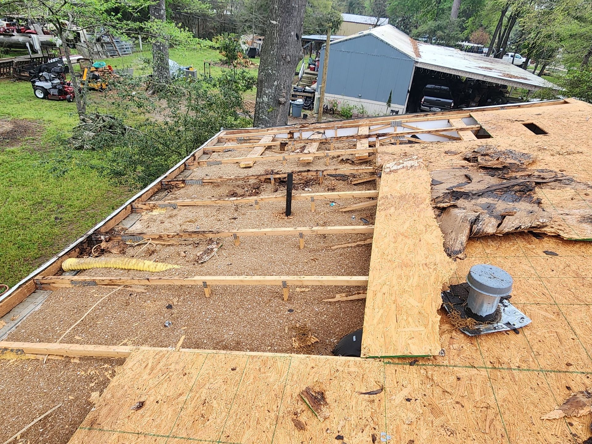 The roof of a house is being demolished.