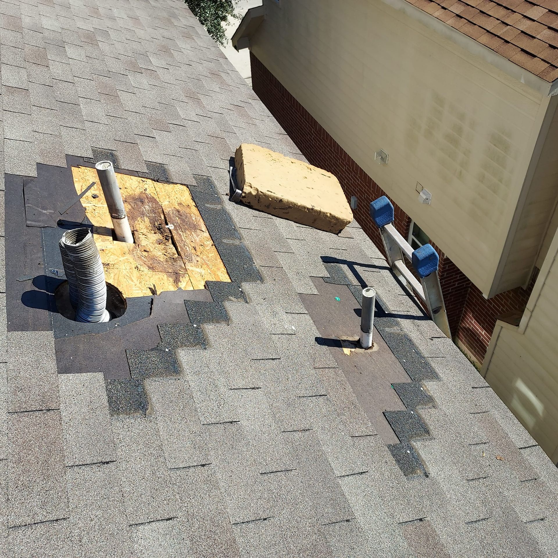 An aerial view of a roof with a hole in it