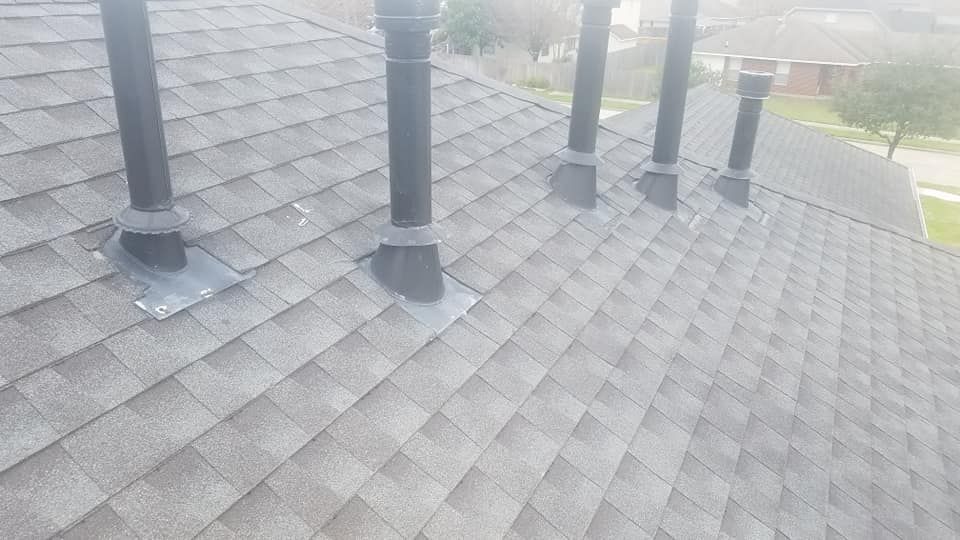 A roof with a lot of chimneys on it.