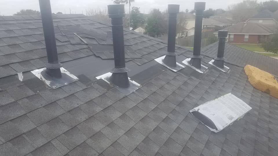 A roof with a lot of chimneys on it.
