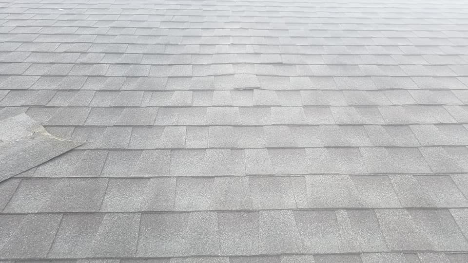 A close up of a roof with shingles on it.