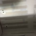 A blurry picture of a ceiling with a light on it.