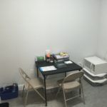 A room with a table and chairs in it.