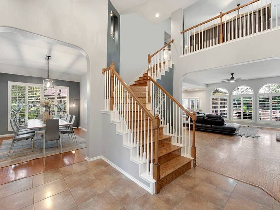 A large house with a staircase leading up to the second floor.