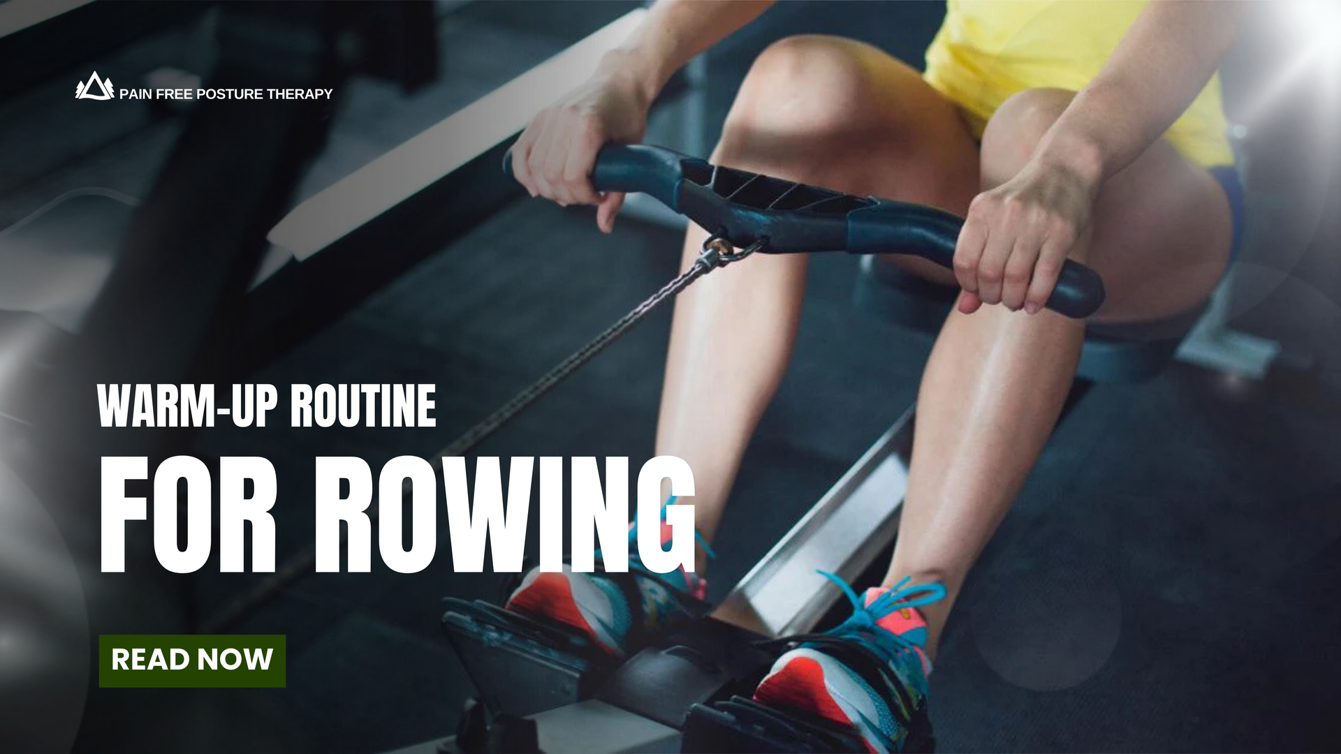 A man is sitting on a rowing machine in a gym.