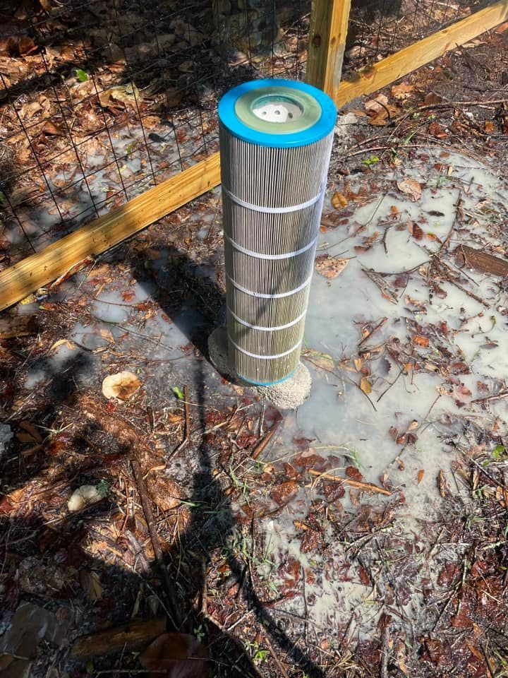 Used Cylindrical Pool Filter on Floor