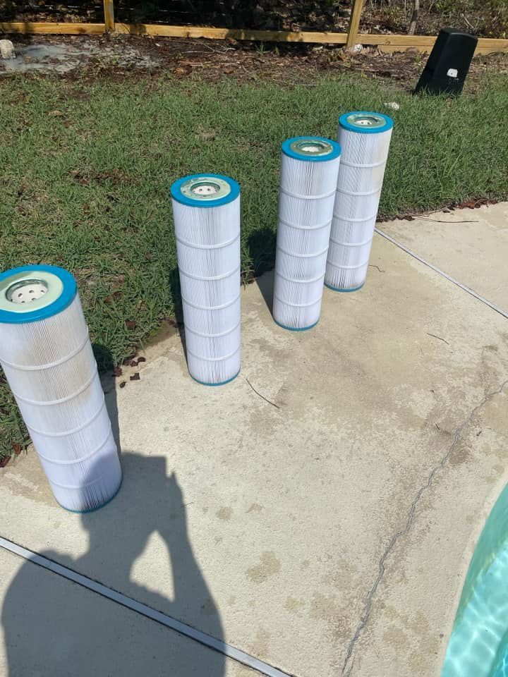 Cylindrical Pool Filters on a Concrete Surface