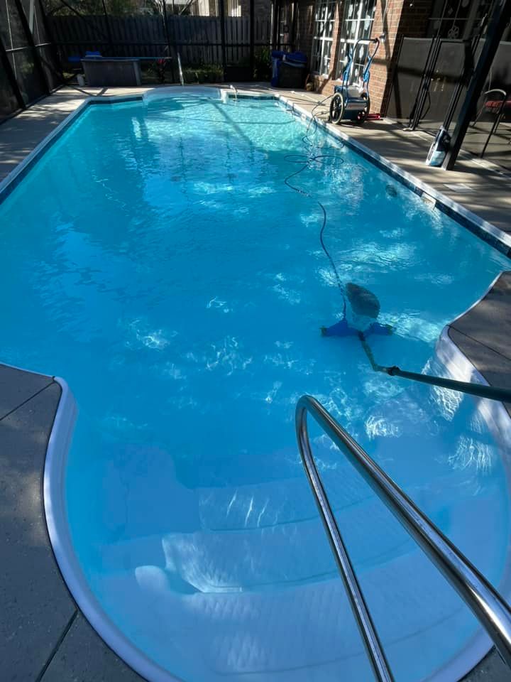 Clear Blue Water of Pool with Silver Railing
