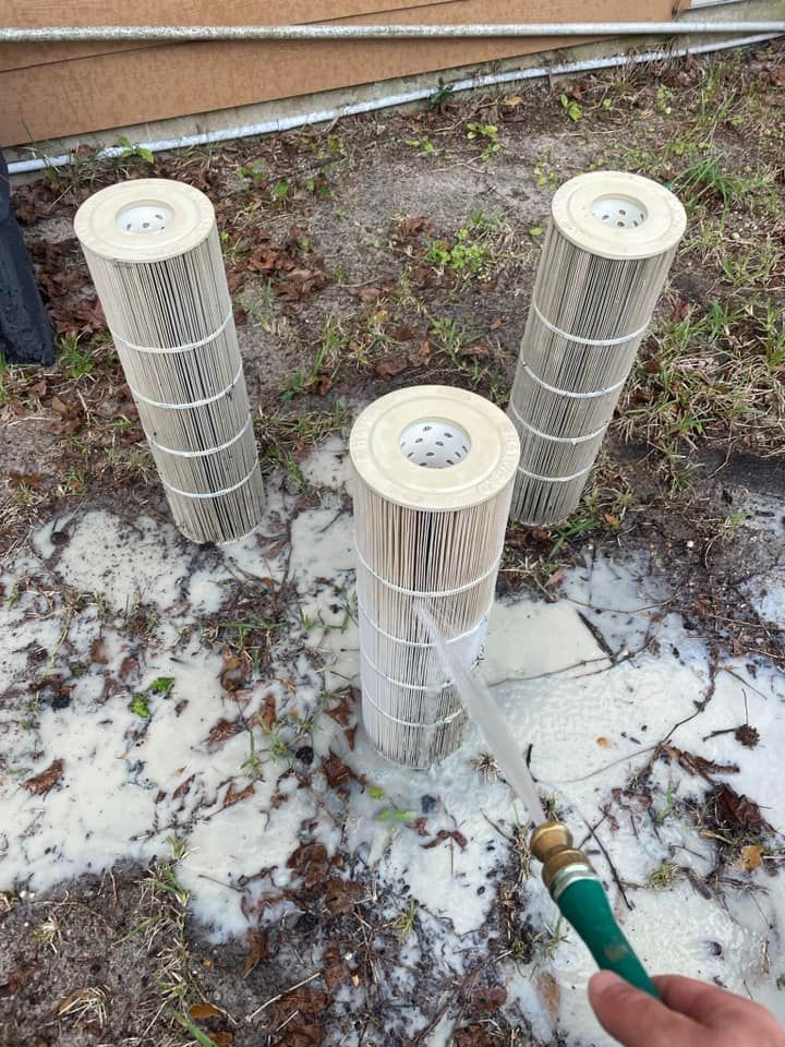 Worker Cleaning the Three Pool Filters