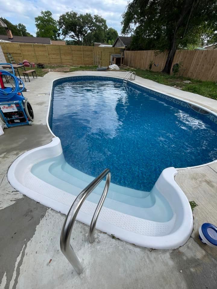 Swimming Pool in a Fenced Backyard
