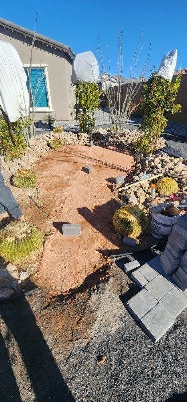 A dirt path is being built in front of a house.