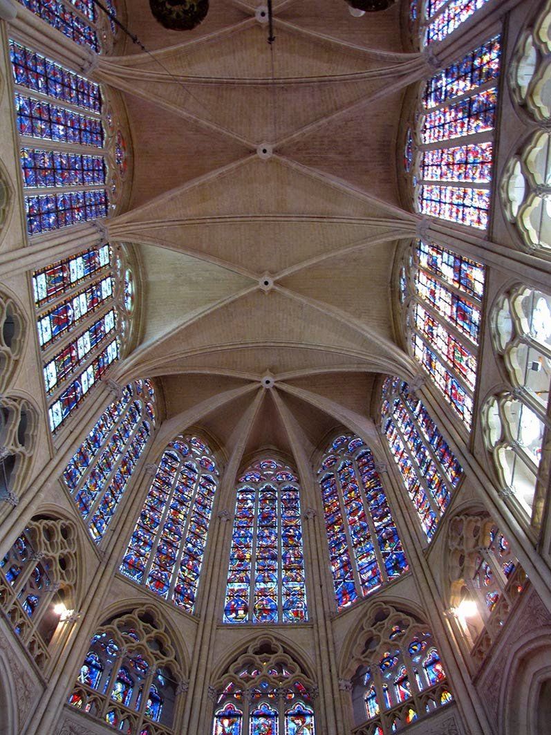 looking up at the stained glass windows in Tours cathedral