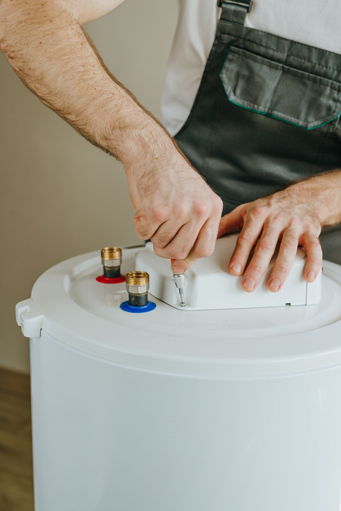 A Man Checking Water Heater — Salina, KS — Salina Plumbing Company