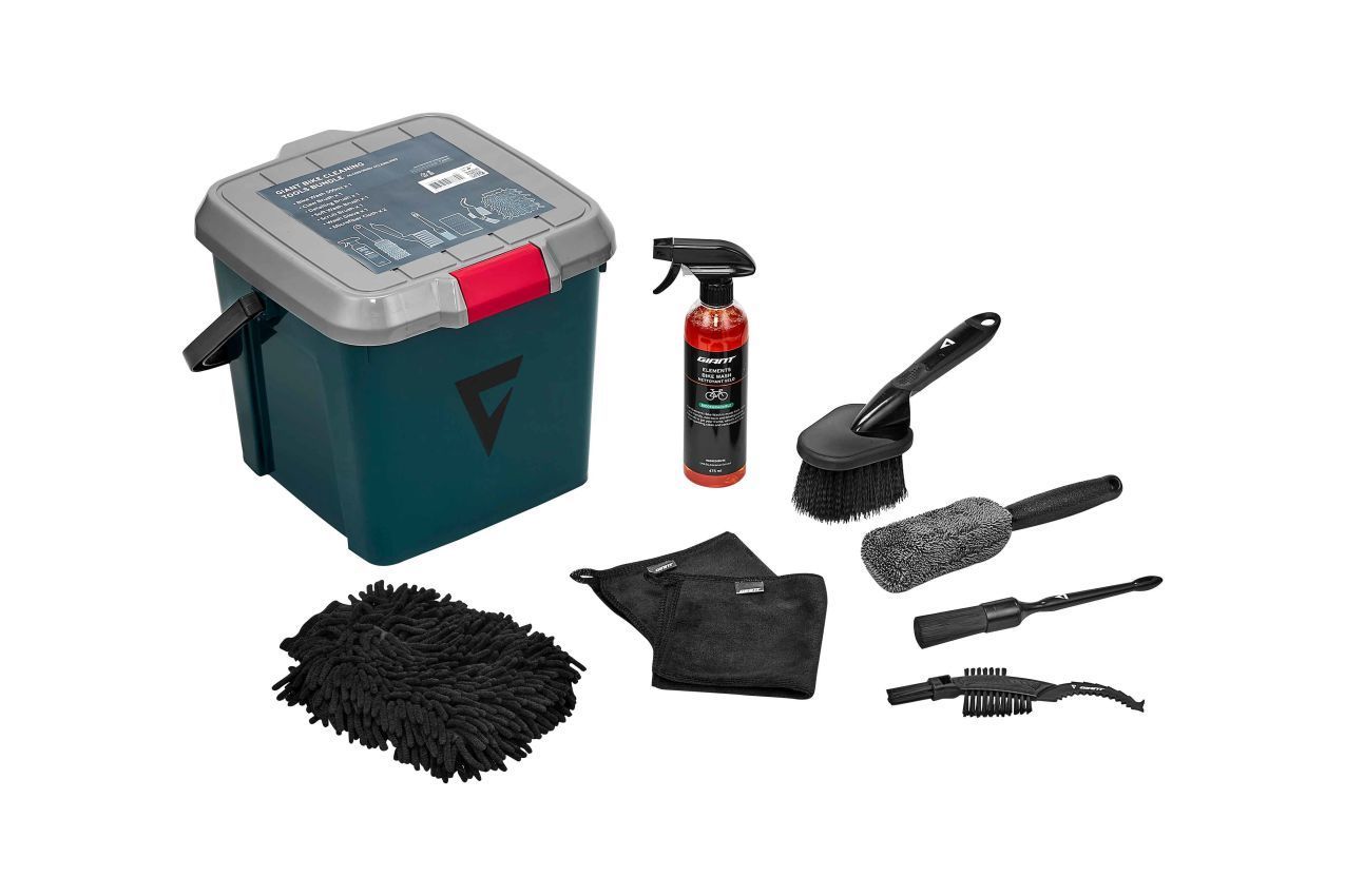 Car washing kit with bucket, spray bottle, brushes, wash mitts, and accessories.