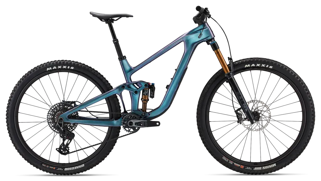 Blue and black mountain bike on a white background with gold suspension forks.