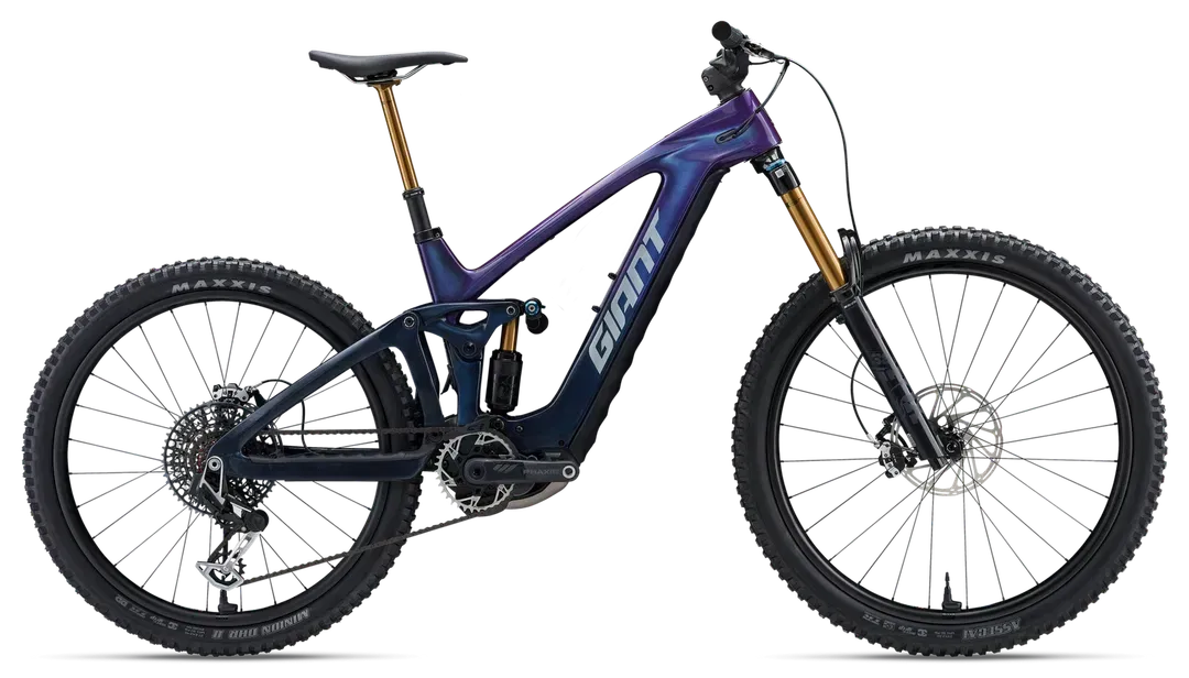 Giant electric mountain bike with dark blue frame, gold suspension, black tires.
